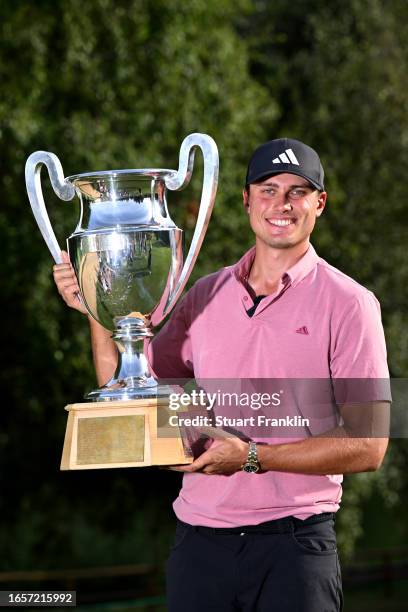 Ludvig Aberg of Sweden poses with the Omega European Masters trophy during Day Four of the Omega European Masters at Crans-sur-Sierre Golf Club on...