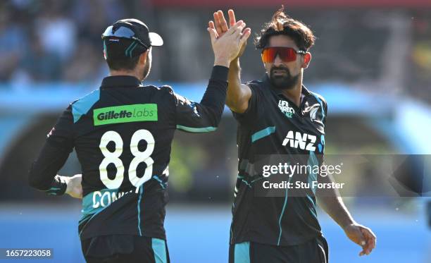 New Zealand Ish Sodhi celebrates with Devon Conway after Sodhi had taken the wicket of England batsman Harry Brook hits out only to be caught during...