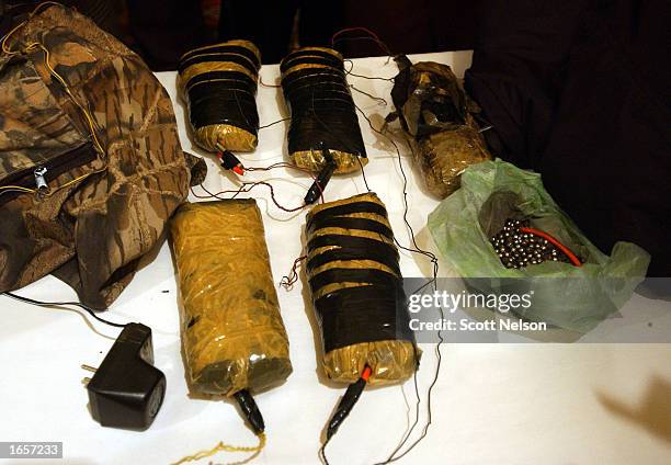 More than 10 kilos of C4 plastic explosives and shrapnel rigged for a suicide vest are displayed by Afghan authorities November 23, 2002 in Kabul,...