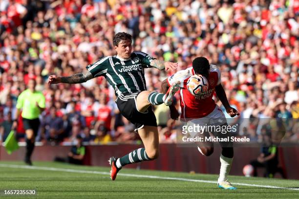 Eddie Nketiah of Arsenal is fouled by Victor Lindeloef of Manchester United during the Premier League match between Arsenal FC and Manchester United...