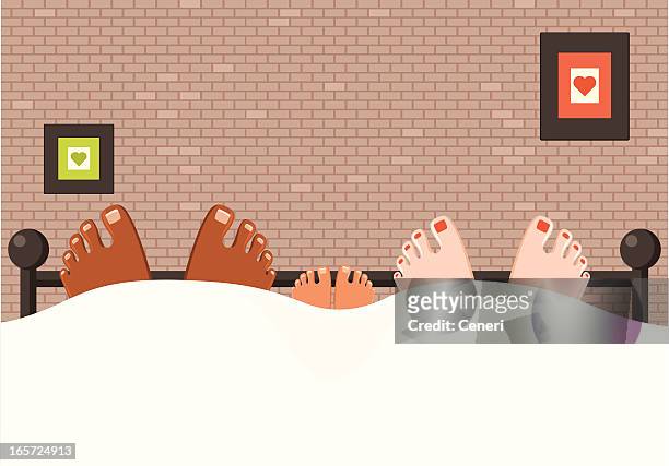 loving interracial family, feet in bed - bed male stock illustrations