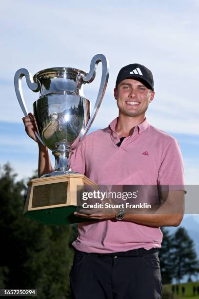Ludvig Aberg of Sweden poses with the Omega European Masters trophy during Day Four of the Omega European Masters at Crans-sur-Sierre Golf Club on...