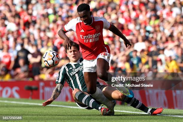 Eddie Nketiah of Arsenal is fouled by Victor Lindeloef of Manchester United during the Premier League match between Arsenal FC and Manchester United...