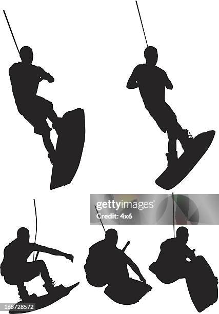 men wakeboarding - wakeboarding stock illustrations