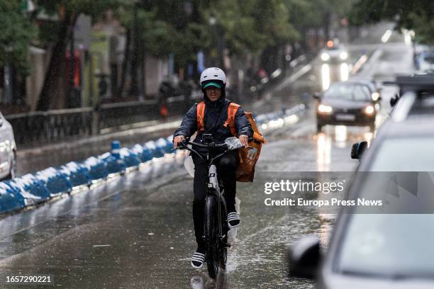 Delivery driver works in the rain on September 3 in Madrid, Spain. The DANA, which arrived on September 1, has brought heavy rainfall to much of the...