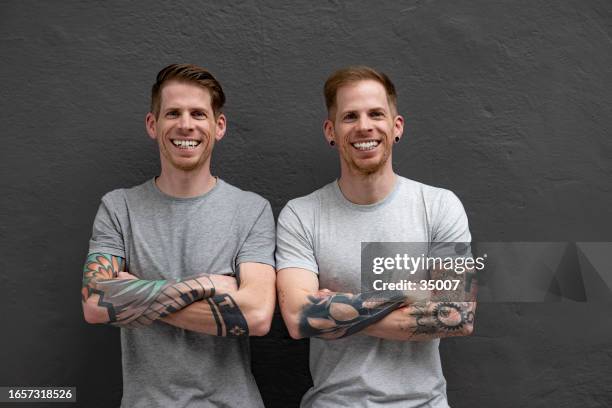 twin brothers big smile - twin stock pictures, royalty-free photos & images