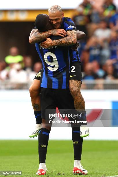 Marcus Thuram of Inter Milan celebrates after scoring the team's first goal with Federico Dimarco during the Serie A TIM match between FC...