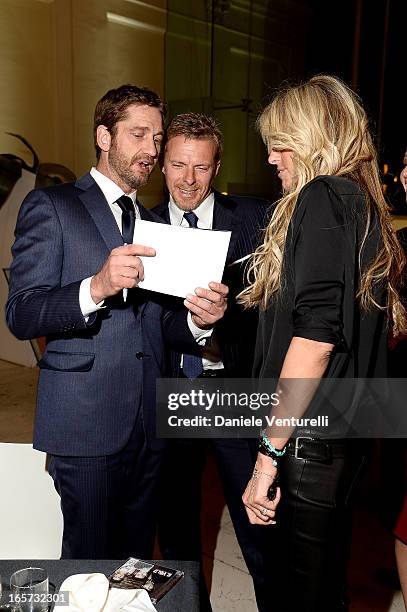 Gerard Butler, Kaspar Capparoni and Tiziana Rocca attend the gala dinner by Antonello Colonna for the movie 'Olympus Has Fallen' on April 5, 2013 in...