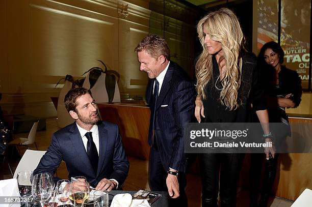 Gerard Butler, Kaspar Capparoni and Tiziana Rocca attend the gala dinner by Antonello Colonna for the movie 'Olympus Has Fallen' on April 5, 2013 in...