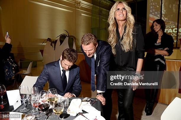 Gerard Butler, Kaspar Capparoni and Tiziana Rocca attend the gala dinner by Antonello Colonna for the movie 'Olympus Has Fallen' on April 5, 2013 in...