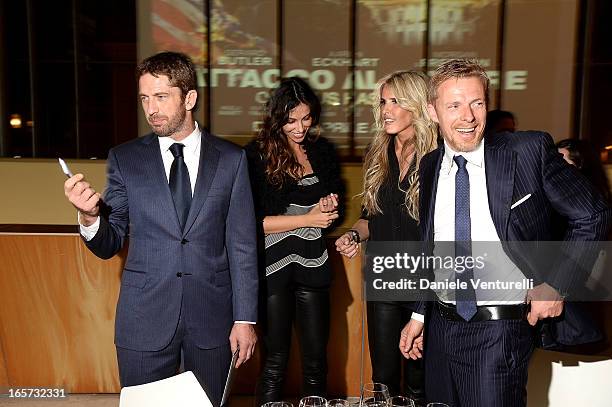 Gerard Butler, Madalina Ghenea, Kaspar Capparoni and Tiziana Rocca attend the gala dinner by Antonello Colonna for the movie 'Olympus Has Fallen' on...