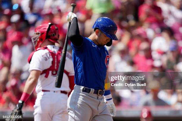 Seiya Suzuki of the Chicago Cubs reacts after striking out in the first inning against the Cincinnati Reds at Great American Ball Park on September...