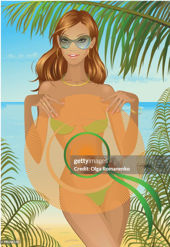 Pretty girl with hat at the beach