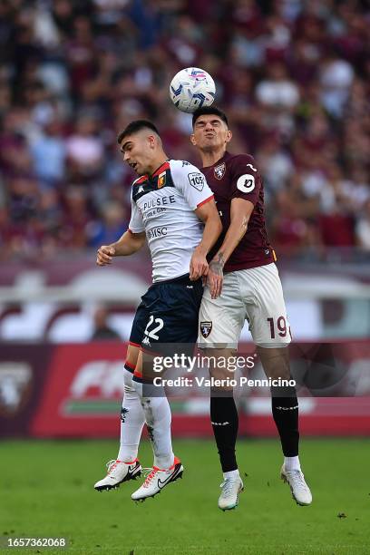 Raoul Bellanova of Torino FC battles for possession with Johan Vasquez of Genoa CFC during the Serie A TIM match between Torino FC and Genoa CFC at...