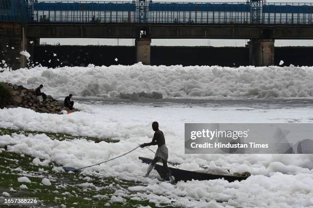 After heavy rainfall Yamuna river covered with a thick layer of toxic foam due to water pollution near Kalindi Kunj, on September 10, 2023 in New...