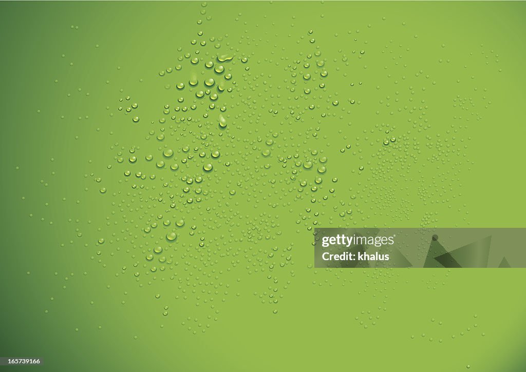 Clear water drops over a green background