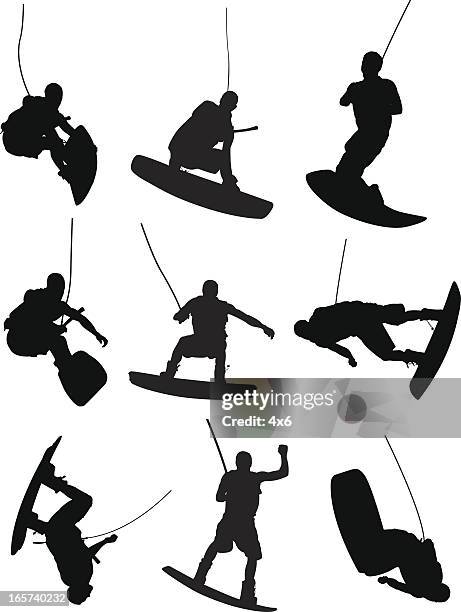 men landing sweet jumps on wakeboard - wakeboarding stock illustrations