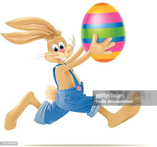 running easterbunny with big easter egg - easter bunny cartoon stock illustrations