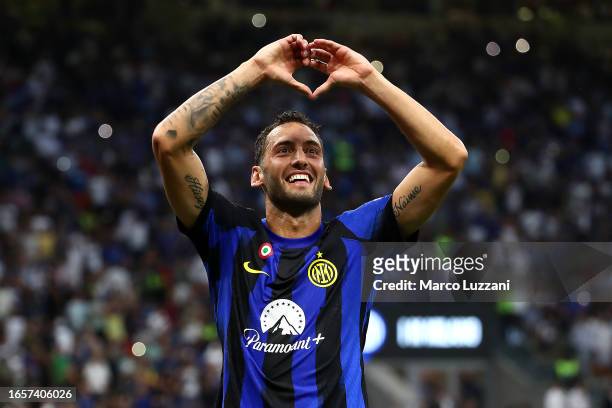 Hakan Calhanoglu of Inter Milan celebrates after scoring the team's third goal during the Serie A TIM match between FC Internazionale and ACF...