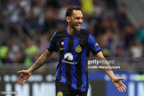 Hakan Calhanoglu of Inter Milan celebrates after scoring the team's third goal during the Serie A TIM match between FC Internazionale and ACF...