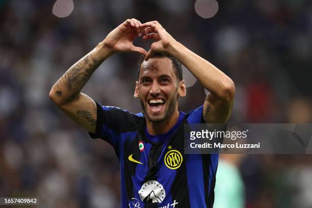 Hakan Calhanoglu of Inter Milan celebrates after scoring the team's third goal during the Serie A TIM match between FC Internazionale and ACF...