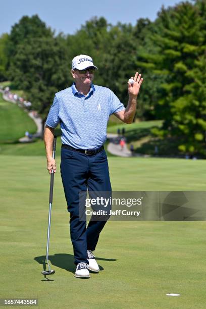 Steve Flesch waves to the crowd after putting for an eagle on the second green during the third round of the Ascension Charity Classic at Norwood...