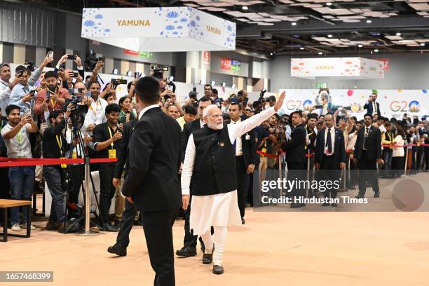 Prime Minister Narendra Modi visits and greets the media persons at Media Centre, Bharat Mandapam after the closing of G20 Summit, on September 10,...