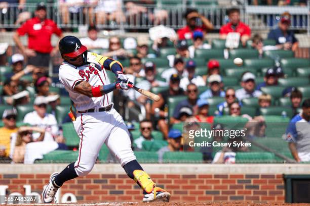 Ronald Acuna Jr. #13 of the Atlanta Braves hits a two-RBI single to give the Braves a 3-2 lead over the Pittsburgh Pirates in the bottom of the...