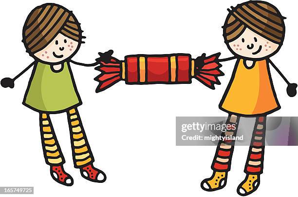 two girls with a large christmas cracker - christmas cracker vector stock illustrations