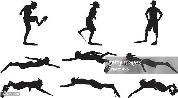 man in snorkel and flippers snorkeling - snorkeling stock illustrations