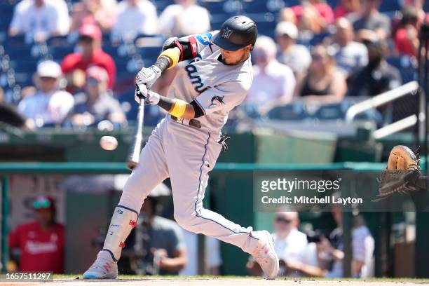 Luis Arraez of the Miami Marlins hits a solo home run In the first inning during a baseball game against the Washington Nationals at Nationals Park...
