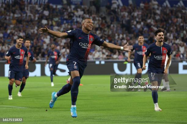 Kylian Mbappe of PSG celebrates after scoring a first half penalty to give the side a 1-0 lead during the Ligue 1 Uber Eats match between Olympique...