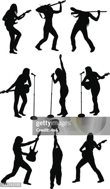 rocker chick playing guitar and singing - holding microphone stock illustrations