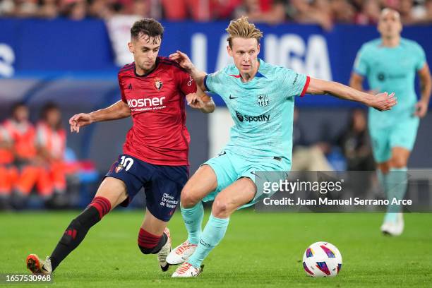 Frenkie de Jong of FC Barcelona battles for possession with Aimar Oroz of CA Osasuna during the LaLiga EA Sports match between CA Osasuna and FC...