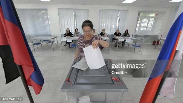 Woman votes at a polling station during local elections organised by the Russian-installed authorities in Donetsk, Russian-controlled Ukraine, on...