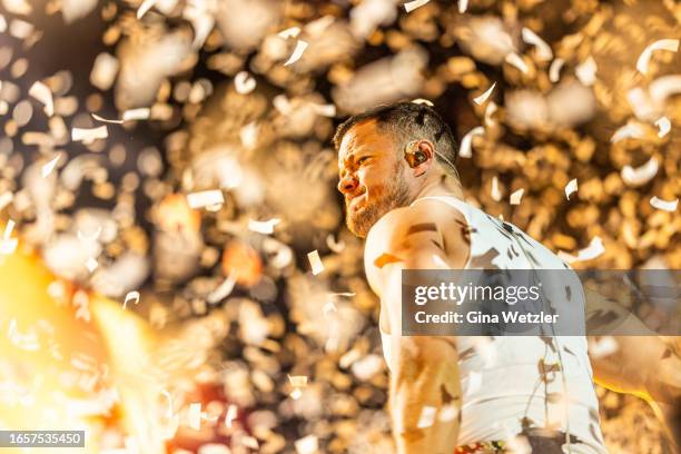 Singer Dan Reynolds of Imagine Dragons performs live on stage during day 2 of Lollapalooza Berlin 2023 at Olympiapark on September 10, 2023 in...