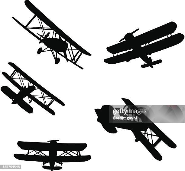 stockillustraties, clipart, cartoons en iconen met biplane silhouetes - bedrijfsvliegtuig