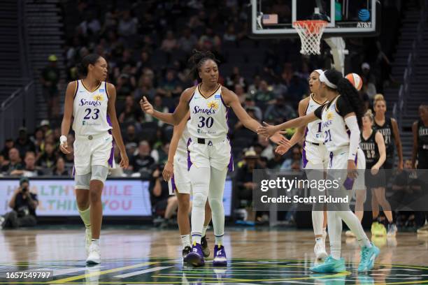 Nneka Ogwumike of the Los Angeles Sparks high fives teammates during the game against the Seattle Storm on September 10, 2023 at Climate Pledge Arena...