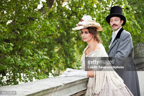 costume themed victorian couple on balcony - period costume stock pictures, royalty-free photos & images