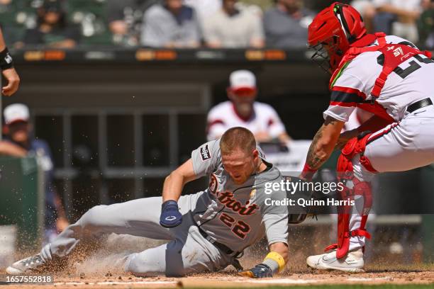 Parker Meadows of the Detroit Tigers slides home to score in the second inning against Korey Lee of the Chicago White Sox at Guaranteed Rate Field on...