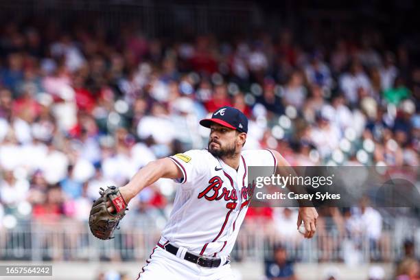 Brad Hand of the Atlanta Braves delivers in the top of the seventh inning against the Pittsburgh Pirates at Truist Park on September 10, 2023 in...