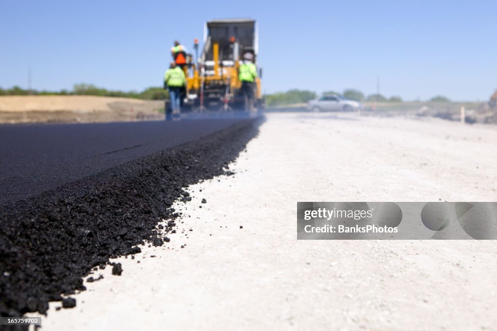 Blacktop Paving Road with Paver and Dump Truck