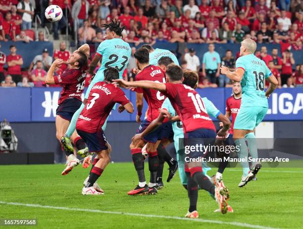 Jules Kounde of FC Barcelona scores the team's first goal during the LaLiga EA Sports match between CA Osasuna and FC Barcelona at Estadio El Sadar...