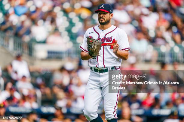 Brad Hand of the Atlanta Braves celebrates in the seventh inning against the Pittsburgh Pirates at Truist Park on September 10, 2023 in Atlanta,...