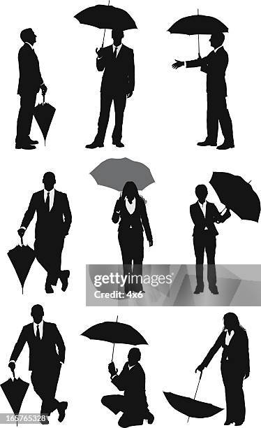 businesspeople silhouettes posing with umbrellas - hands in pockets vector stock illustrations