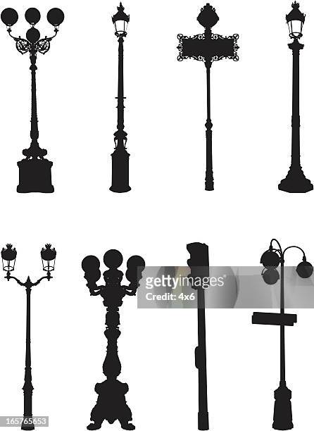 assorted street light silhouettes - street name sign stock illustrations