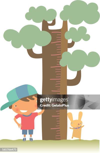 stockillustraties, clipart, cartoons en iconen met young boy and pet checking their height against a tree - groeimeter