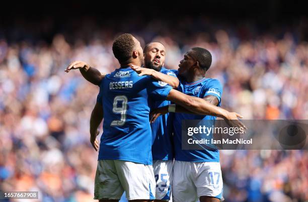 Kemar Roofe of Rangers celebrates with Rabbi Matondo and Cyriel Dessers after scoring, only for the goal to be disallowed by VAR during the Cinch...