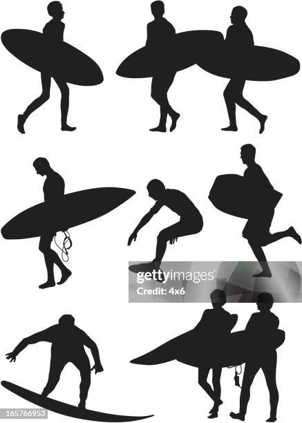 surfers carrying surfboards and surfing - standing stock illustrations