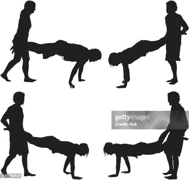picnic games human wheelbarrow - wheelbarrow race adults stock illustrations